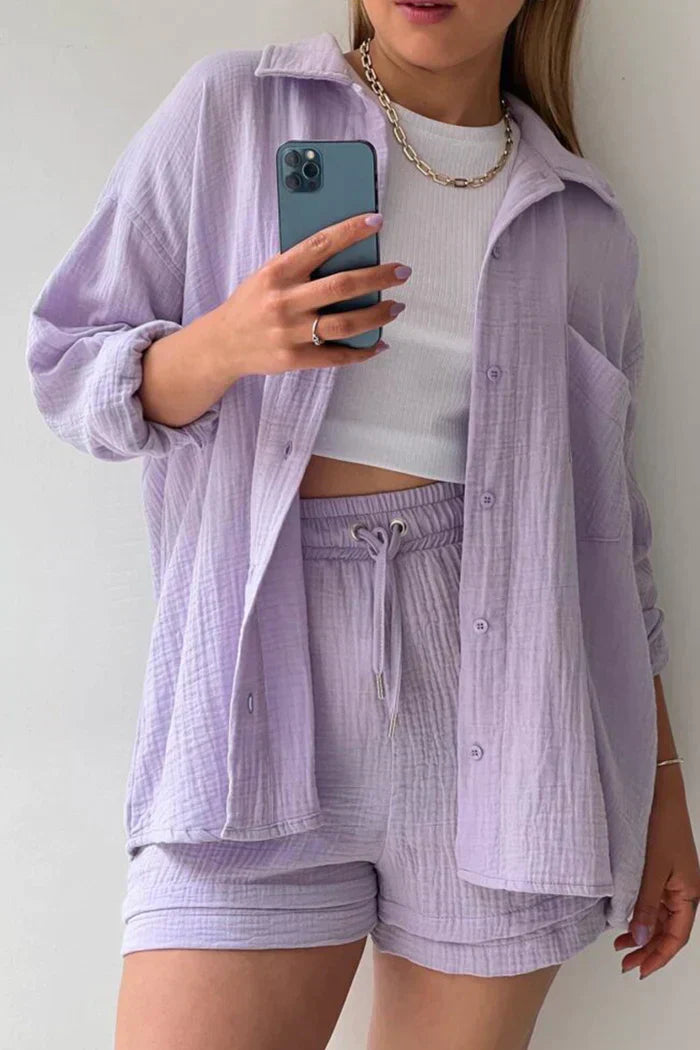 Women's vibrant summer lounge set featuring a button-up shirt and high-waist shorts in a bold, casual style.