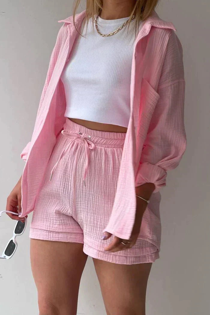 Women's vibrant summer lounge set featuring a button-up shirt and high-waist shorts in a bold, casual style.