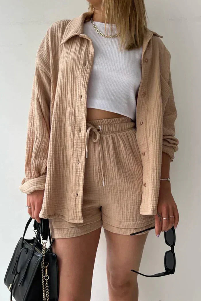 Women's vibrant summer lounge set featuring a button-up shirt and high-waist shorts in a bold, casual style.