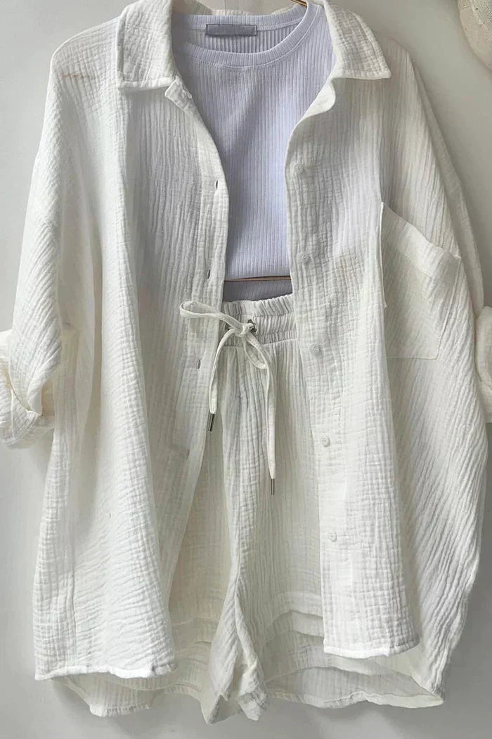 Women's vibrant summer lounge set featuring a button-up shirt and high-waist shorts in a bold, casual style.