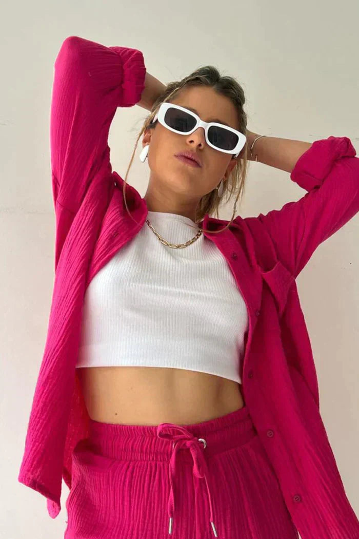 Women's vibrant summer lounge set featuring a button-up shirt and high-waist shorts in a bold, casual style.