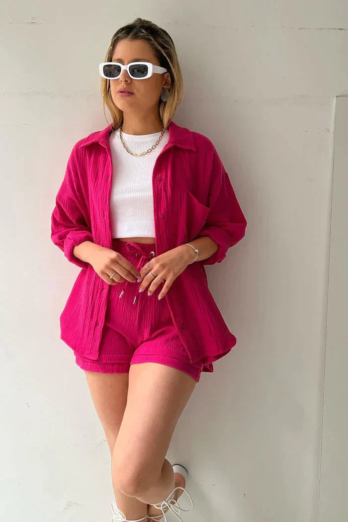 Women's vibrant summer lounge set featuring a button-up shirt and high-waist shorts in a bold, casual style.