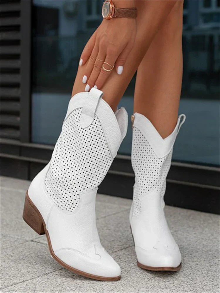 "Women's western ankle boots with pointed toe, block heel, faux leather finish, and pull-on tabs for easy wear."