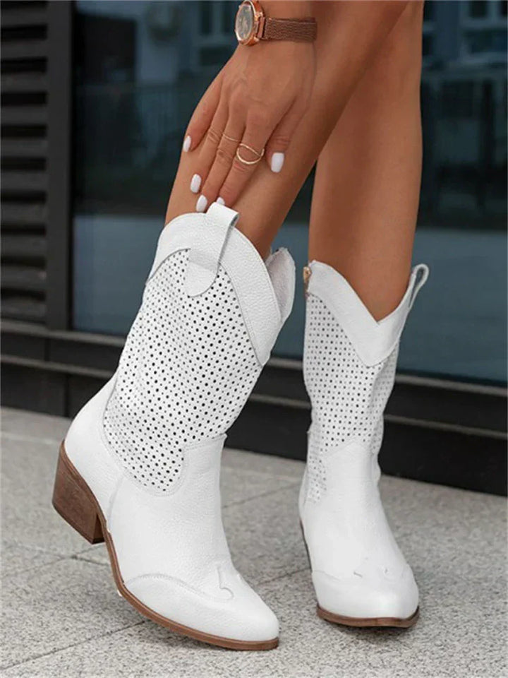 "Women's western ankle boots with pointed toe, block heel, faux leather finish, and pull-on tabs for easy wear."