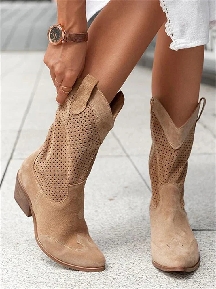 "Women's western ankle boots with pointed toe, block heel, faux leather finish, and pull-on tabs for easy wear."